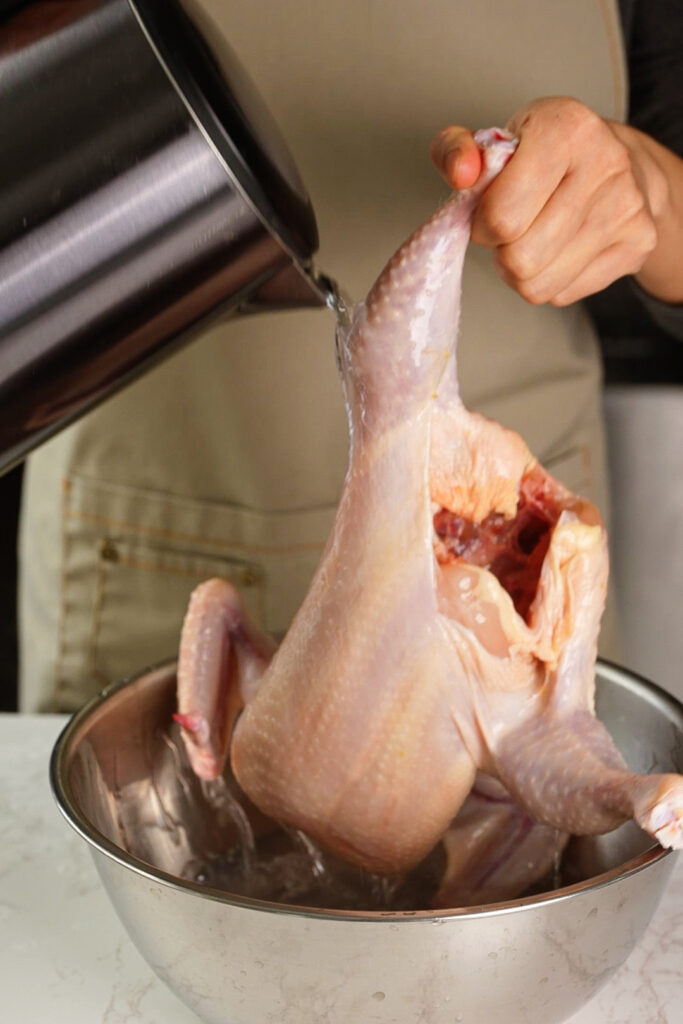 splash hot water on chicken skin