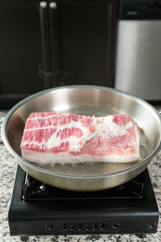 blanch the pork belly skin side down